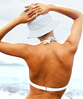 woman showing her back wearing a bathing suite